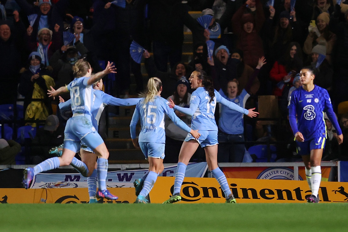 Carolyn Weir celebrates with teammates Lauren Hemp and Ellen White after scoring  the winner for Manchester City