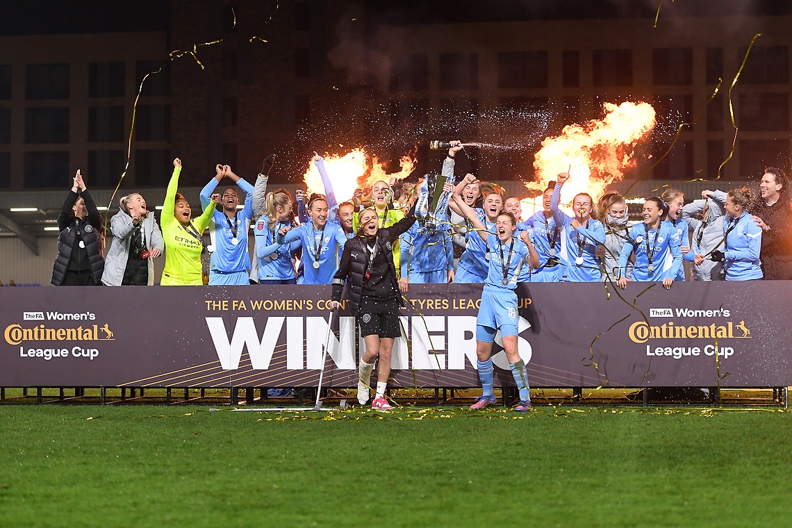 Ellen White lifts The FA Women's Continental Tyres League Cup trophy together with Steph Houghton following Manchester City's A Women's Continental Tyres League Cup Final 2021-22