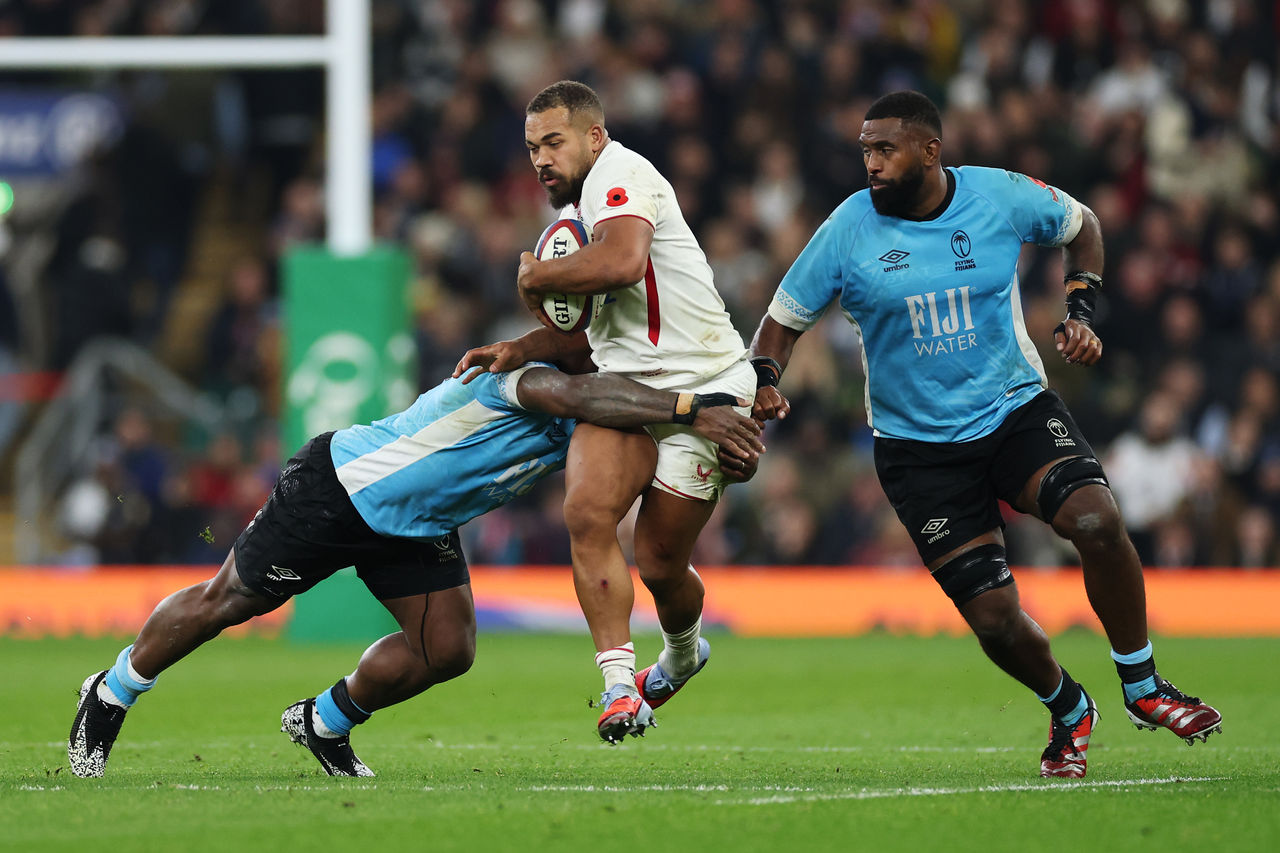 LONDON, ENGLAND - NOVEMBER 08: Ollie Lawrence of England is tackled by Josua Tuisova of Fiji during the Quilter Nations Series 2025 match between England and Fiji at Allianz Stadium on November 08, 2025 in London, England. (Photo by Dan Mullan - RFU/The RFU Collection via Getty Images)